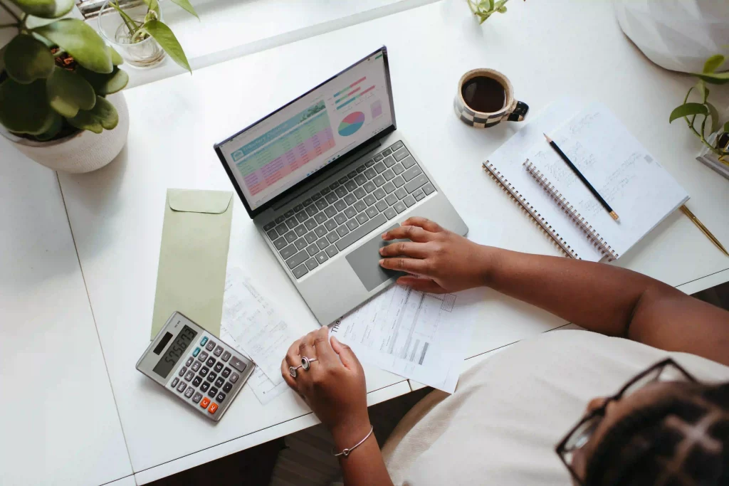 Individual at a desk, busy with work